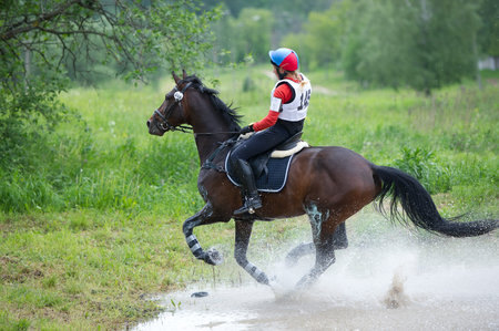 MOSCOW - JUNE 02  Unidentified rider on horse is overcomes the obstacle at the International Eventing Competition CCI3  2  1  Russian Cup Eventing June 02, 2012 in Moscow, Russiaの写真素材