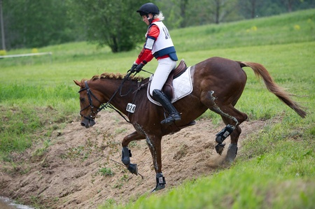MOSCOW - JUNE 02  Unidentified rider on horse is overcomes the obstacle at the International Eventing Competition CCI3  2  1  Russian Cup Eventing June 02, 2012 in Moscow, Russiaの写真素材