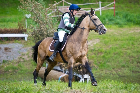 MOSCOW - JUNE 02  Unidentified rider on horse is overcomes the obstacle at the International Eventing Competition CCI3  2  1  Russian Cup Eventing June 02, 2012 in Moscow, Russiaの写真素材