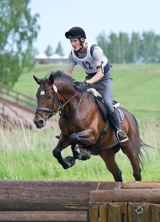 MOSCOW - JUNE 02  Unidentified rider on horse is overcomes the obstacle at the International Eventing Competition CCI3  2  1  Russian Cup Eventing June 02, 2012 in Moscow, Russiaの写真素材