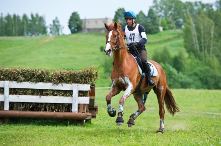 MOSCOW - JUNE 02  Unidentified rider on horse is overcomes the obstacle at the International Eventing Competition CCI3  2  1  Russian Cup Eventing June 02, 2012 in Moscow, Russiaの写真素材