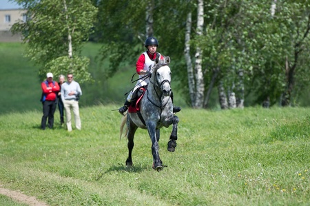 MOSCOW - JUNE 02  Unidentified rider on horse is overcomes the obstacle at the International Eventing Competition CCI3  2  1  Russian Cup Eventing June 02, 2012 in Moscow, Russiaの写真素材