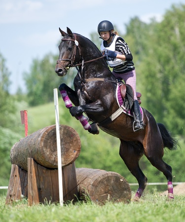 MOSCOW - JUNE 02  Unidentified rider on horse is overcomes the obstacle at the International Eventing Competition CCI3  2  1  Russian Cup Eventing June 02, 2012 in Moscow, Russiaの写真素材