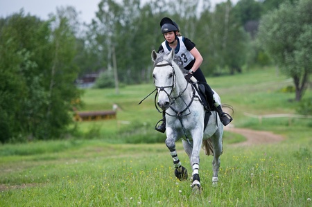 MOSCOW - JUNE 02  Unidentified rider on horse is overcomes the obstacle at the International Eventing Competition CCI3  2  1  Russian Cup Eventing June 02, 2012 in Moscow, Russiaの写真素材