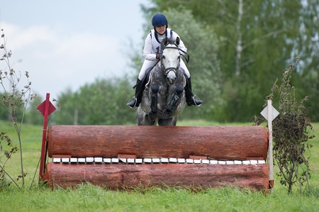 MOSCOW - JUNE 02  Unidentified rider on horse is overcomes the obstacle at the International Eventing Competition CCI3  2  1  Russian Cup Eventing June 02, 2012 in Moscow, Russiaの写真素材