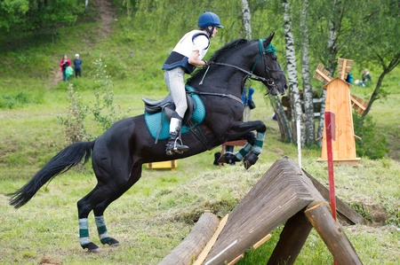 MOSCOW - JUNE 02  Unidentified rider on horse is overcomes the obstacle at the International Eventing Competition CCI3  2  1  Russian Cup Eventing June 02, 2012 in Moscow, Russiaの写真素材