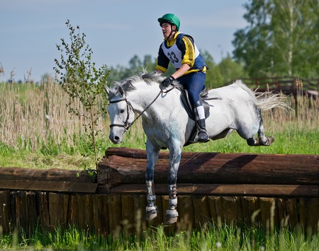 MOSCOW - JUNE 02  Unidentified rider on horse is overcomes the obstacle at the International Eventing Competition CCI3のeditorial素材