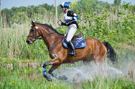 MOSCOW - JUNE 02  Unidentified rider on horse is overcomes the obstacle at the International Eventing Competition CCI3のeditorial素材
