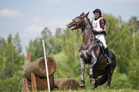 MOSCOW - JUNE 02  Unidentified rider on horse is overcomes the obstacle at the International Eventing Competition CCI3  2  1 Russian Cup Eventing June 02, 2012 in Moscow, Russiaのeditorial素材
