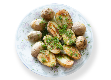 baked potatoes in olive oil with fennel or dillの写真素材