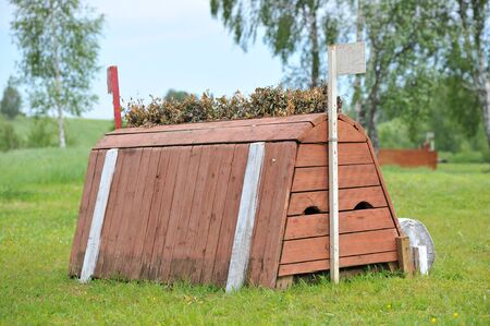 A cross-country a brush fence in a cross country eventの写真素材