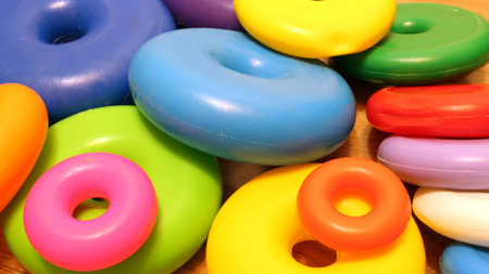 Fallen toy pyramid, plastic toys, colored ringsの写真素材