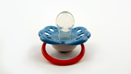 baby's dummy isolated on white. Baby toy.の写真素材