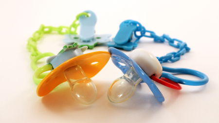 baby's dummy isolated on white. Baby toy.の写真素材