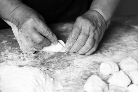Female hands making pizza, foodの写真素材
