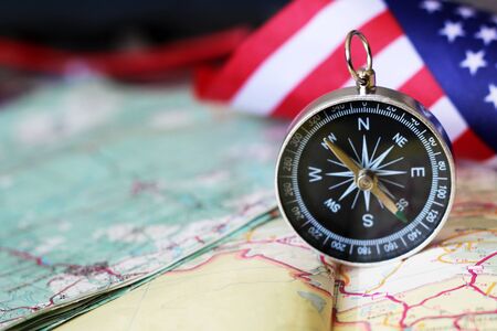 The compass on the American flag and a map of the area, travelの写真素材