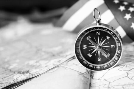 The compass on the American flag and a map of the area, travelの写真素材