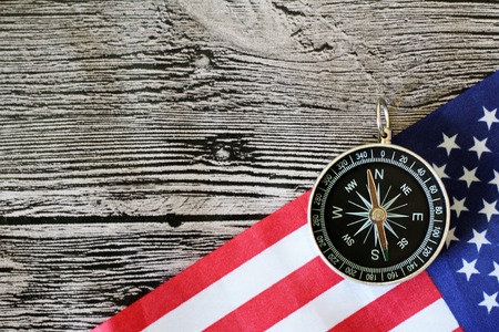 The compass on the American flag and a map of the area, travelの写真素材