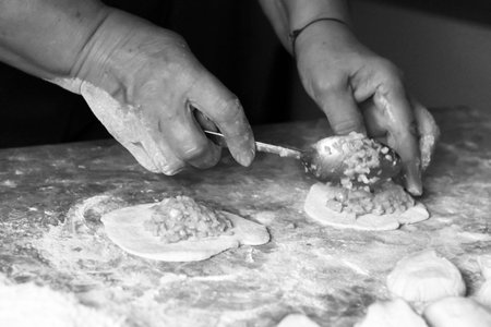Female hands making pizza, foodの写真素材