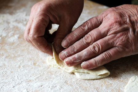 Women's hands cook and flour, cooking