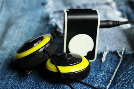 Yellow music player and beautiful overhead headphones, luxの写真素材