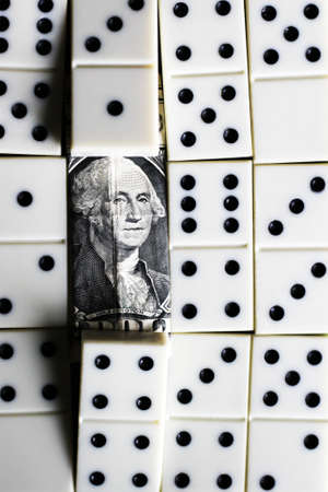 business and finance concept - dominoes and us dollar. Game.の写真素材