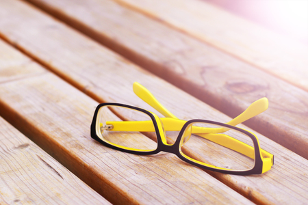 Colorful Eyeglasses on a Park bench, outdoor objectの写真素材