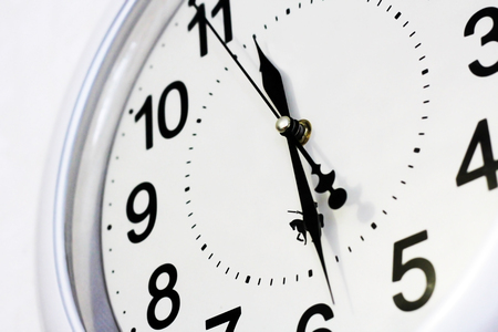Wall clock with large dial.Black numbers on a white background.Object.の写真素材