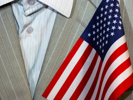 Men's business suit and an American flag, politics and powerの写真素材