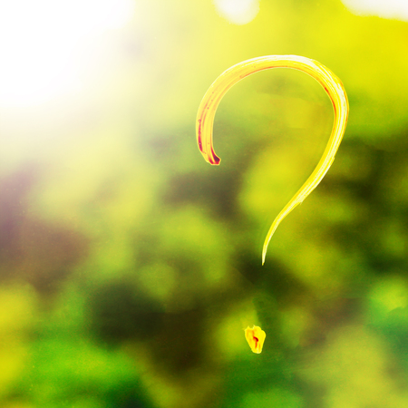 The sign of a question of yellow paint on glass, happyの写真素材