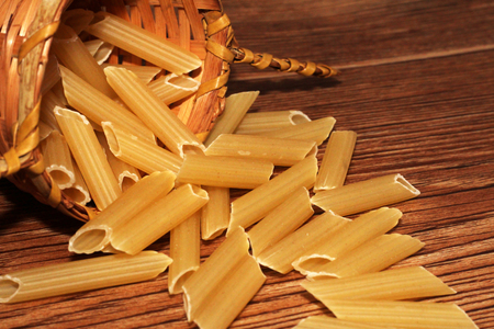 Scattered dry pasta, Italian food tasty objectの写真素材