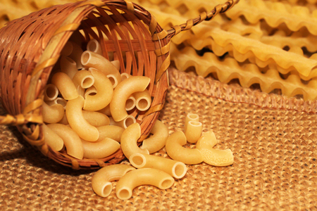 Scattered dry pasta, Italian food tasty objectの写真素材