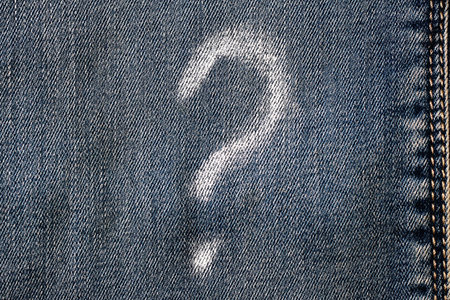 A question mark with chalk on the jeans, style