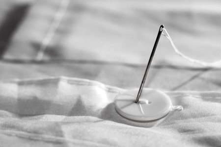 needle with thread and buttons, hobby object