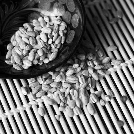 Peeled barley with a wooden spoon, foodの写真素材