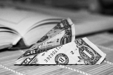 One dollar on open Book, finance and business, air planeの写真素材