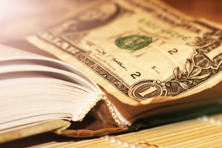 One dollar on open Book, finance and businessの写真素材