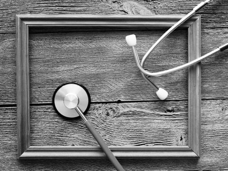 stethoscope for doctor and wooden frame, top viewの写真素材