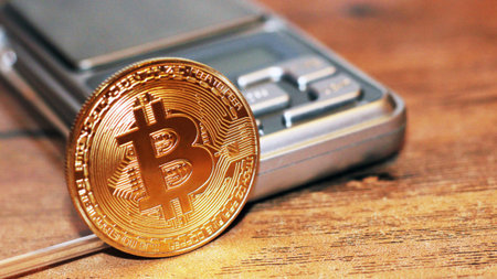 Bitcoin and the electronic scales. New cryptocurrency.の写真素材