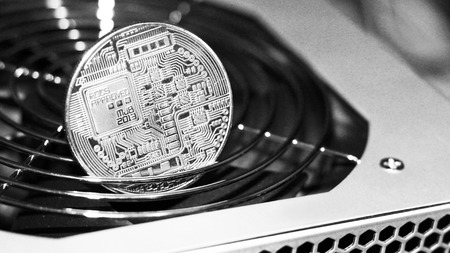 Golden Bitcoin virtual currency on a circuit board background, objectの写真素材