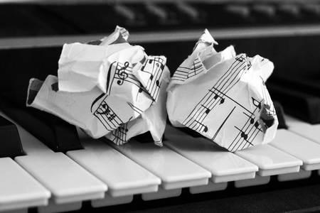 close-up music score on piano keyboard, piece of paper, objectの写真素材