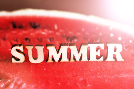 Juicy delicious watermelon and wooden text letters summerの写真素材