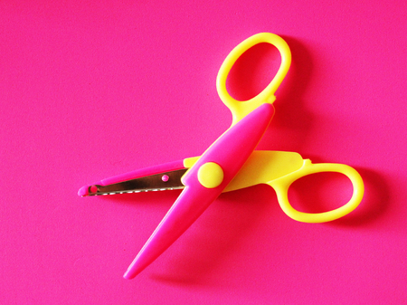 Shaped scissors on pink paper. Scissors for decorating, objectの写真素材