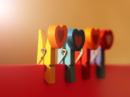 colorful wooden clothespin on a pink paper, setの写真素材