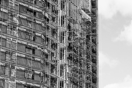 Modern facade of a building with windows reflecting the sky, objectの写真素材