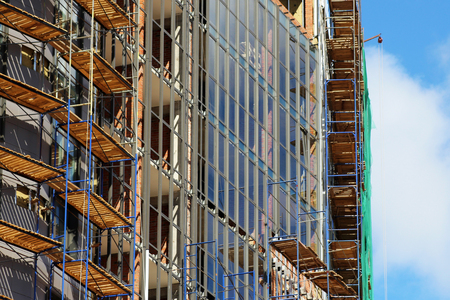 Modern facade of a building with windows reflecting the sky, objectの写真素材