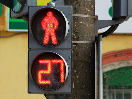 The traffic light for pedestrians, a red stop signal