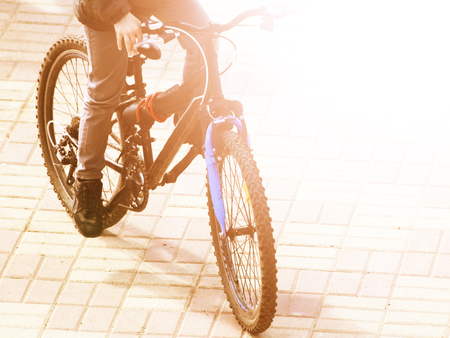 Ride on bike on the road. Sport and active life concept in the summer time, tonedの写真素材