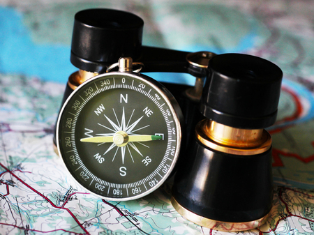Old compass and binoculars on the map, retroの写真素材