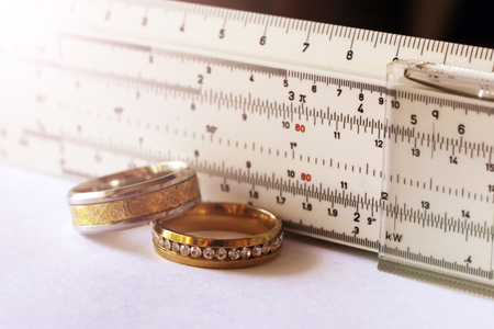 Gold ring with diamonds and a measuring instrument, the value of jewelry, objectの写真素材